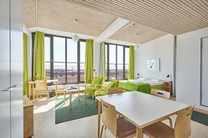 Deluxe Penthouse, 1 Queen Bed, Kitchenette | Desk, soundproofing, free WiFi, bed sheets