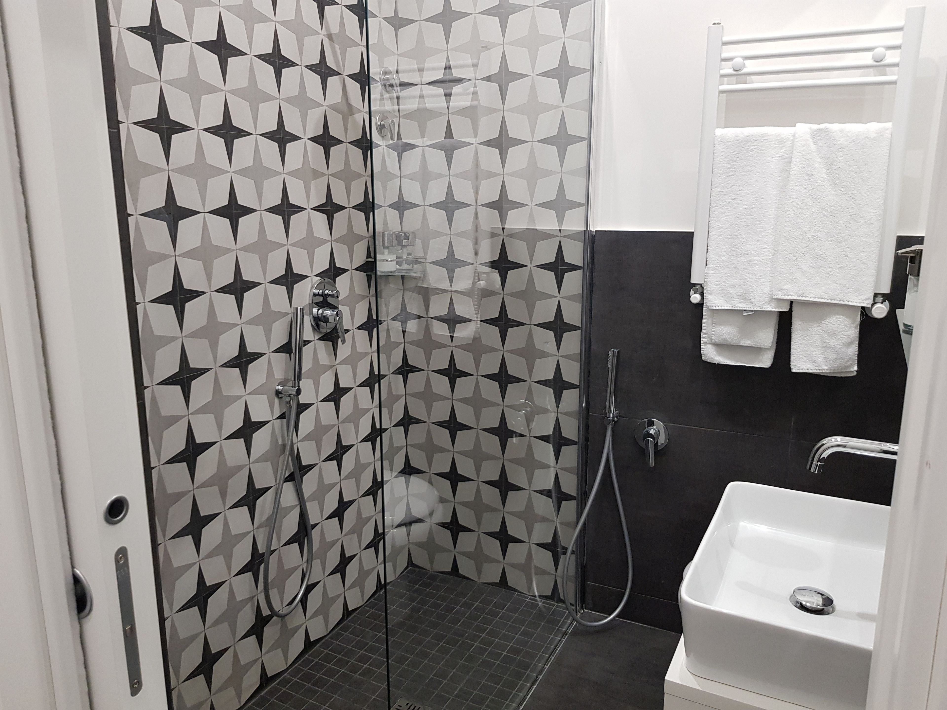family quadruple room | bathroom | shower, rainfall showerhead, free toiletries, hair dryer