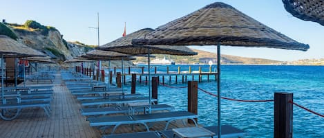 Private beach, free beach shuttle, sun-loungers, beach umbrellas