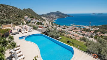 Outdoor pool, open 8 AM to 8 PM, pool umbrellas, pool loungers