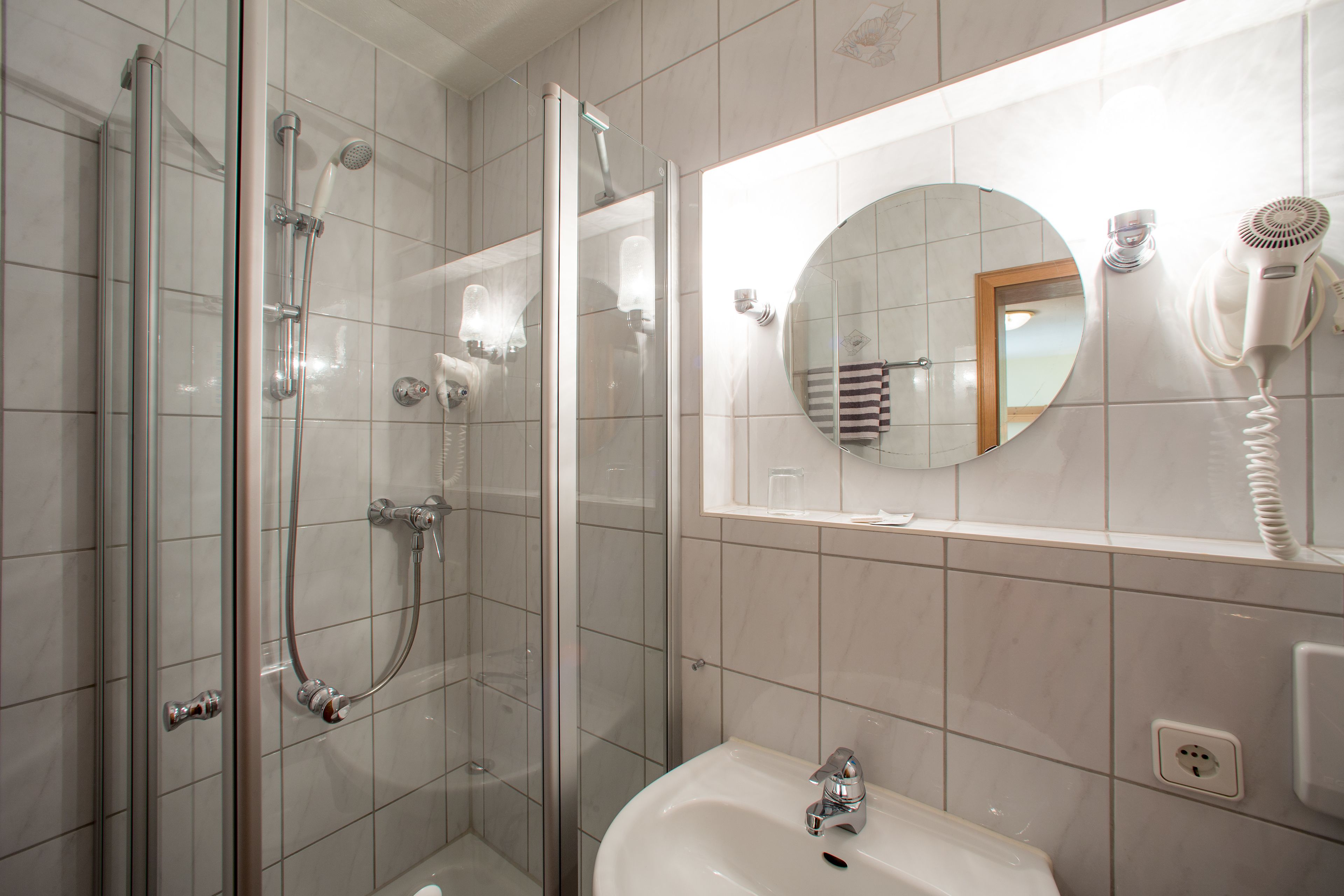 standard double room | bathroom | shower, eco-friendly toiletries, hair dryer, slippers