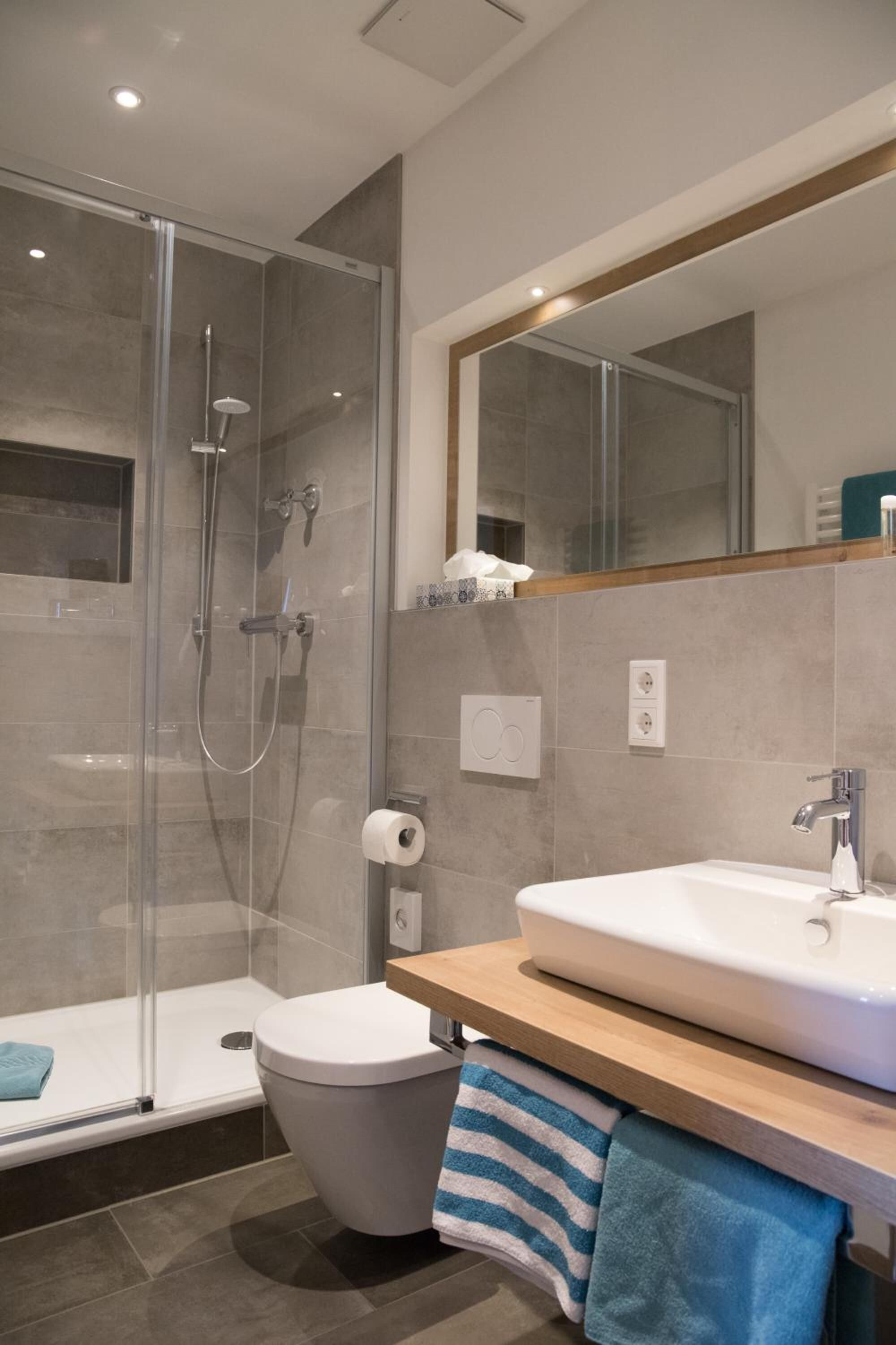 shower, eco-friendly toiletries, hair dryer, slippers