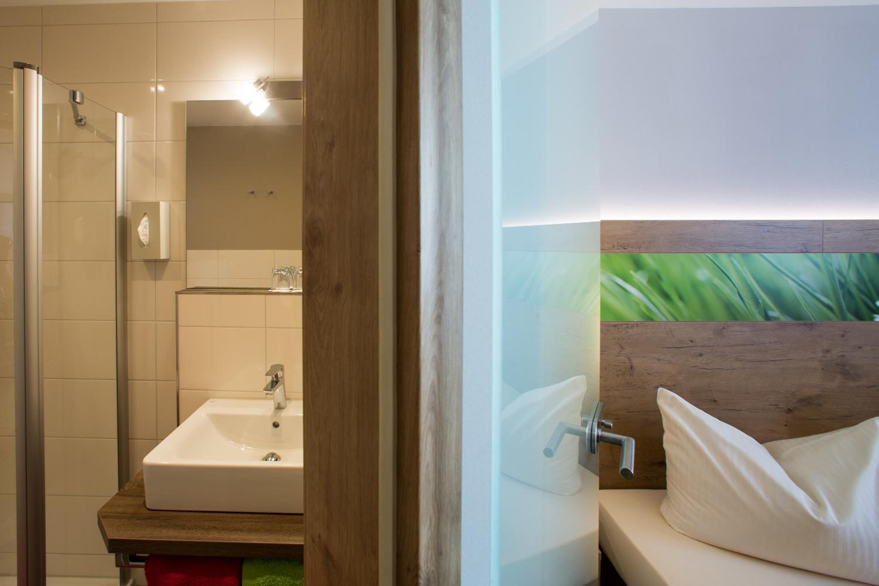 comfort double room | bathroom | shower, eco-friendly toiletries, hair dryer, slippers