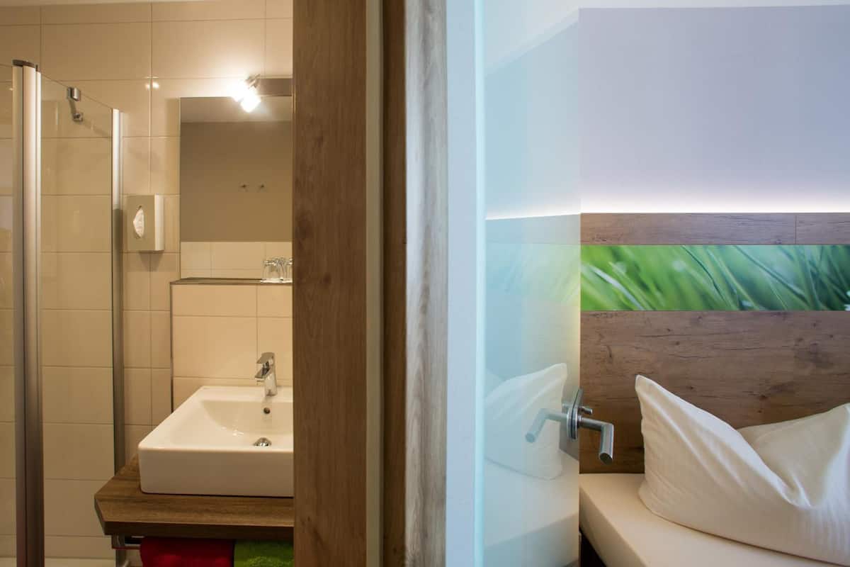 comfort double room | bathroom | shower, eco-friendly toiletries, hair dryer, slippers
