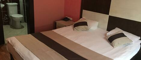 Standard Double Room, River View | Minibar, in-room safe, desk, iron/ironing board