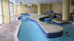 An indoor swimming pool with multiple lanes, blue tiles, and a tiled deck area. - Stunning 3 BR, 3 Bath Grand Atlantic Direct Oceanfront (Myrtle Beach)
