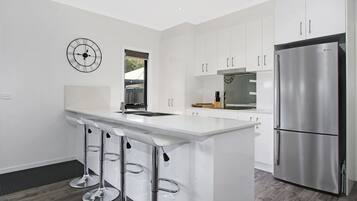 Townhome, 3 Bedrooms | Private kitchen | Full-sized fridge, microwave, oven, stovetop