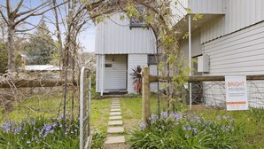 A gated entrance to a property with a sign indicating it is managed by Bright Escapes. - Le Chateau - Centrally located (Bright)