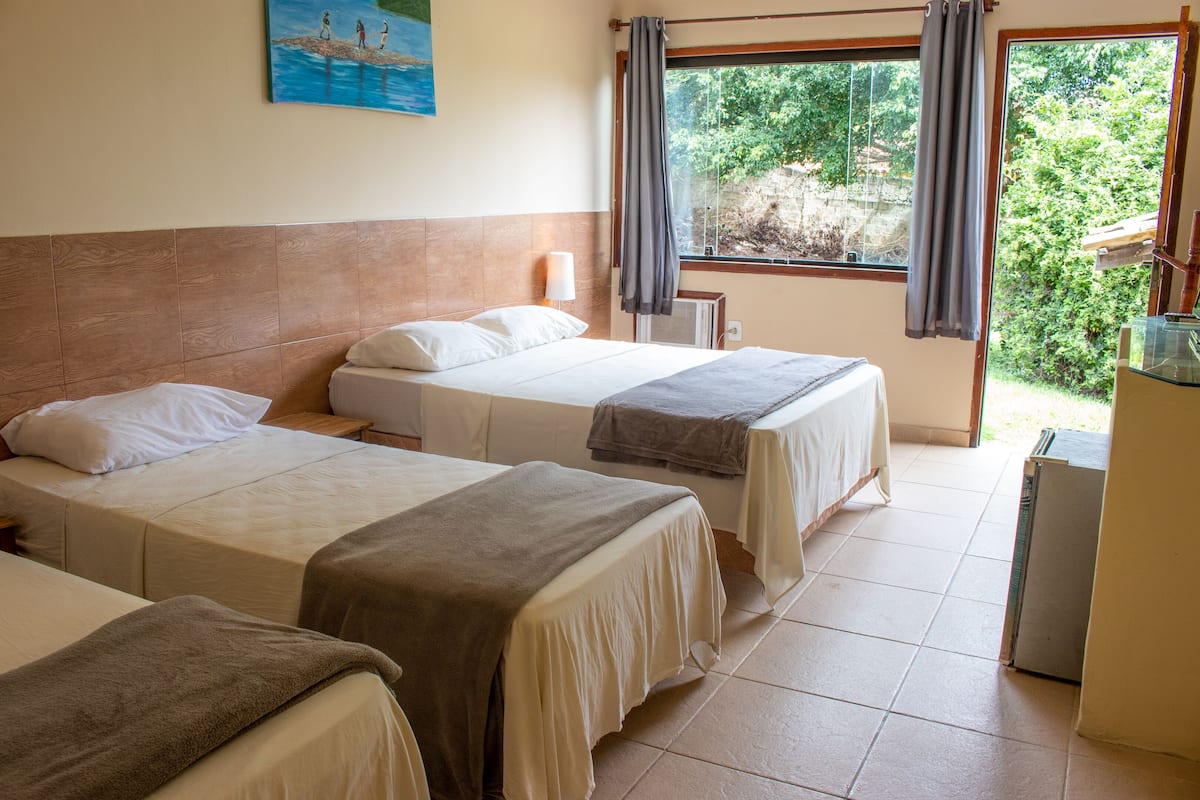 Standard Quadruple Room, 1 Bedroom | Minibar, in-room safe, blackout curtains, free WiFi