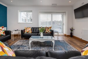 Standard Double Room | Living area | 22-inch LCD TV with cable channels, TV