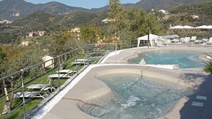 Seasonal outdoor pool, open 9:00 AM to 7:30 PM, pool umbrellas