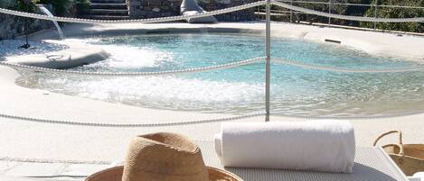 Seasonal outdoor pool, open 9:00 AM to 7:30 PM, pool umbrellas