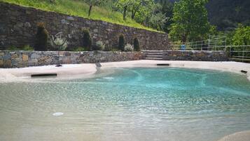 Seasonal outdoor pool, open 9:00 AM to 7:30 PM, pool umbrellas