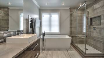 Deep-soaking bathtub, rainfall showerhead, slippers, towels