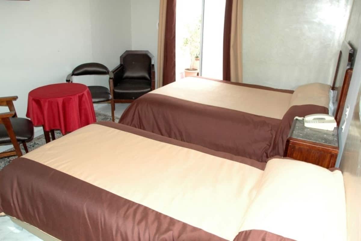 Triple Room | Minibar, in-room safe, desk, soundproofing