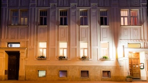 A historic building with multiple windows and a central entrance. - Penzion U Vlka (Ceske Budejovice)