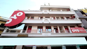 A hotel with a prominent OYO logo, a two-story structure, balconies, and a sign indicating it is the OYO Hotel Supremo. - OYO 8278 Supremo (Chandigarh)