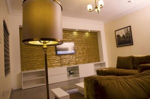 Apartment, 3 Bedrooms | Living room | Flat-screen TV