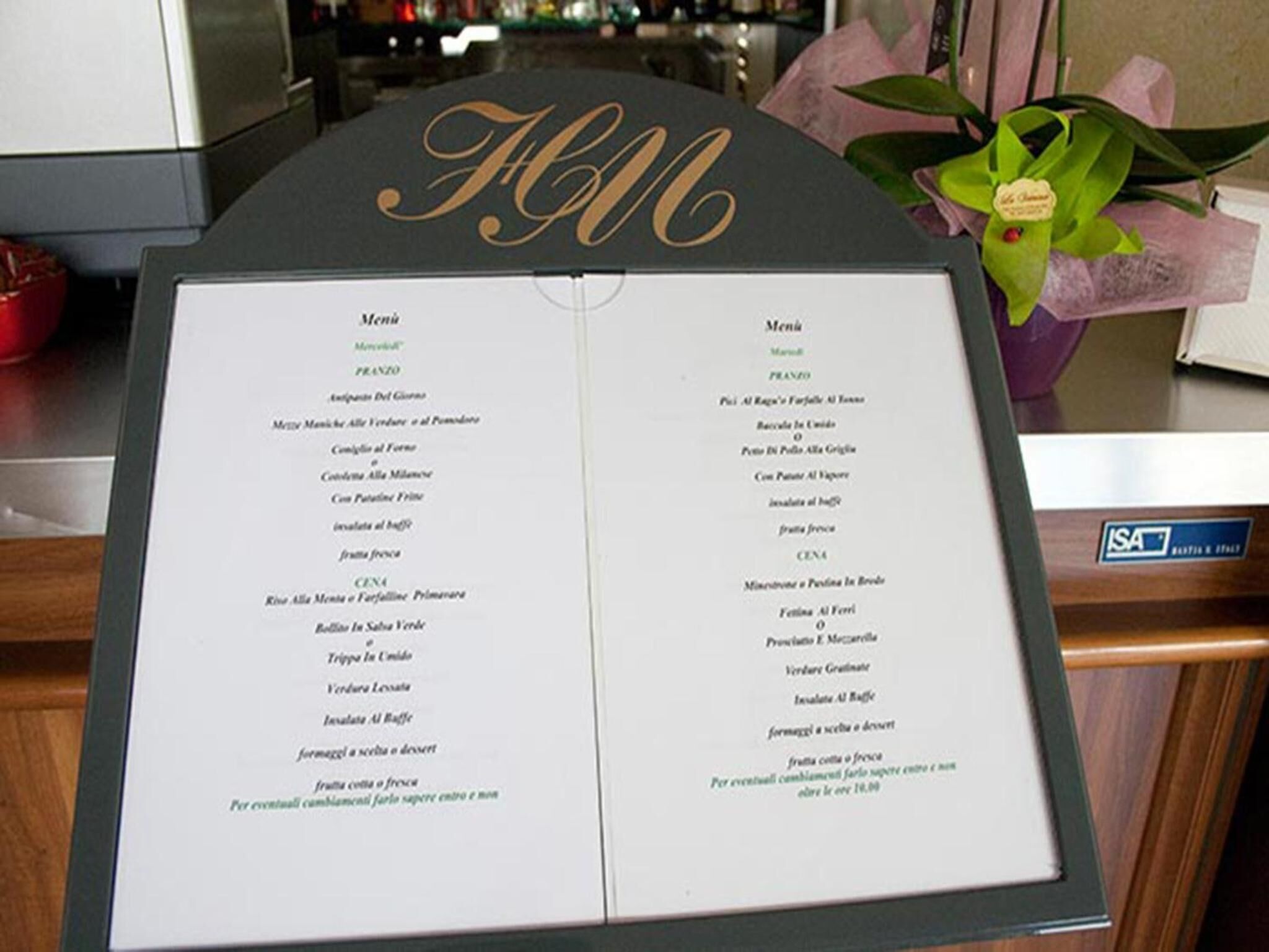 A menu board with two sections labeled "Menu" and "Menù" in English and Italian, respectively.