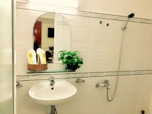 Shower, free toiletries, hair dryer, slippers