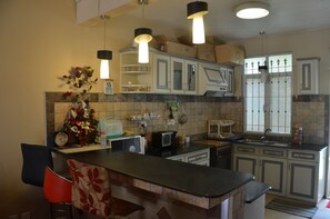 Apartment, Pool View | Private kitchen | Fridge, microwave, stovetop, electric kettle - Residence Mon Choisy (Mont Choisy)