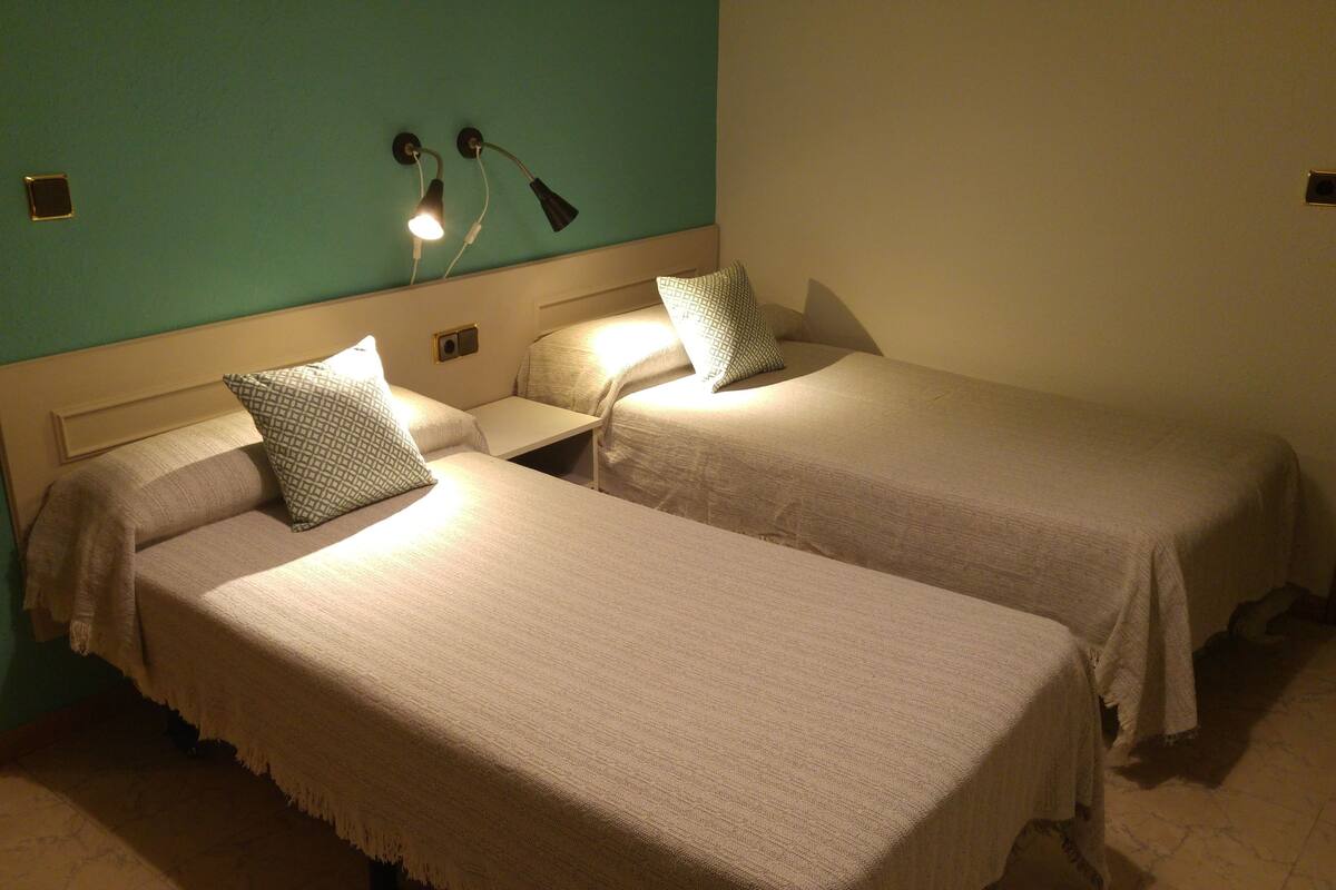 Twin Room | Desk, blackout drapes, WiFi (free), bed sheets