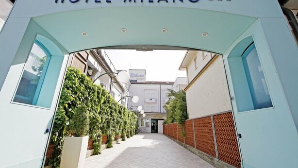 The entrance to Hotel Milano with a clear pathway leading to the main entrance. - Hotel Milano (Cesenatico)