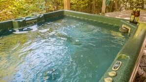 A hot tub with a wooden frame, surrounded by a forest. -  Resort Mountain Home with  Private Hot tub Walk to Pools, Pond WIFI (Campton)