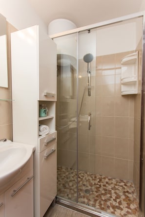 Shower, hair dryer, towels, soap