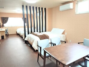 A hotel room with a bed, a desk, a chair, and a table. - Port HOUSE (Osaka)