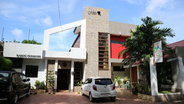 A modern building with a sign reading "MABINI PENSIONE". - Mabini Pensione (Puerto Princesa)