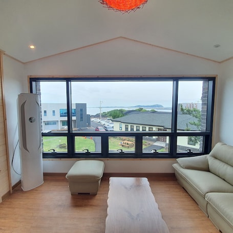 Family Condo, 2 Bedrooms, Non Smoking, Ocean View | Living area | 50-inch flat-screen TV with cable channels, TV, heated floors