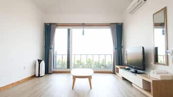 House (A) | Living area | 50-inch flat-screen TV with cable channels, TV, heated floors