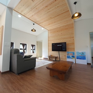Family Condo | Living area | 50-inch flat-screen TV with cable channels, TV, heated floors
