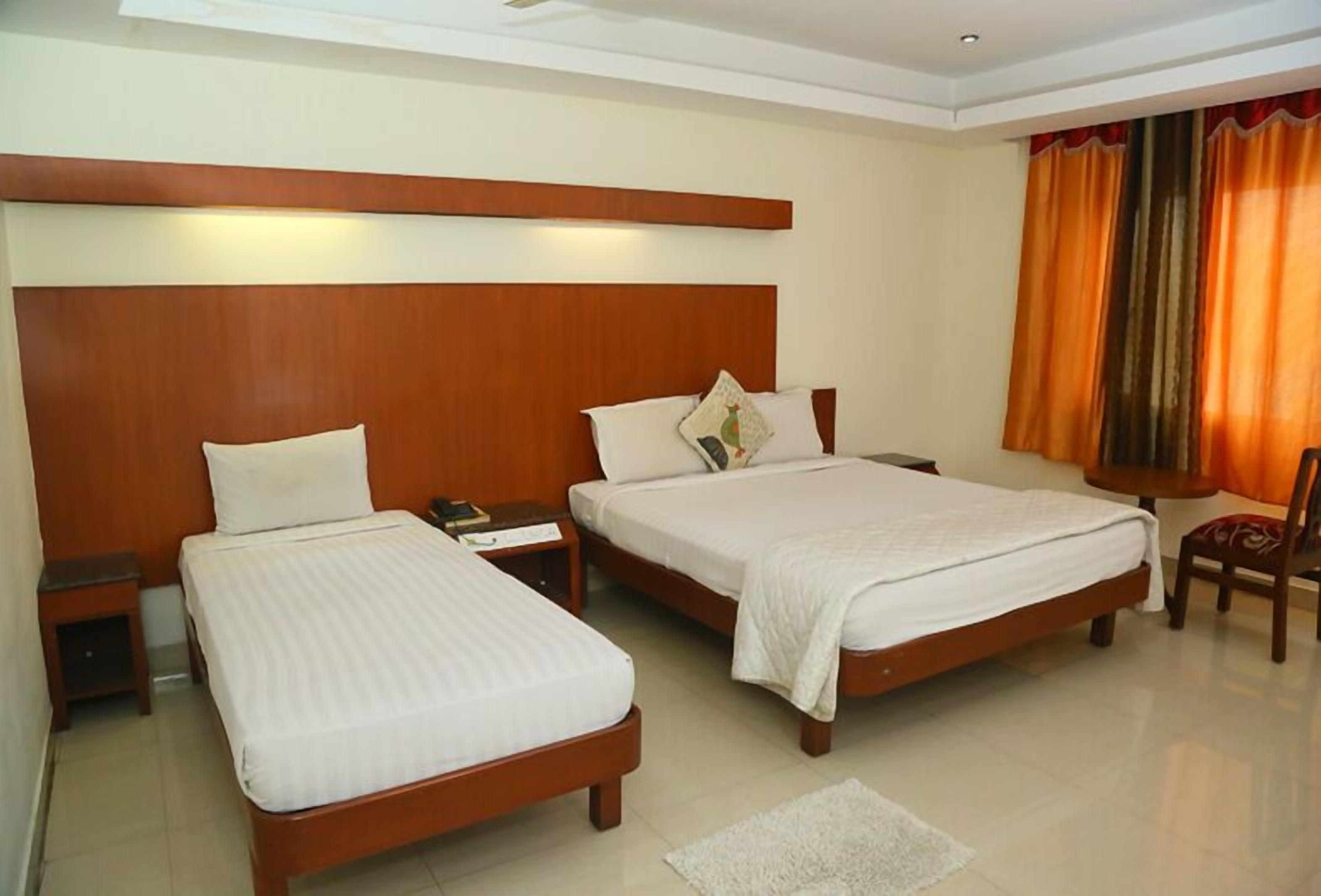Deluxe Room, 1 Queen Bed | In-room safe, rollaway beds, free WiFi
