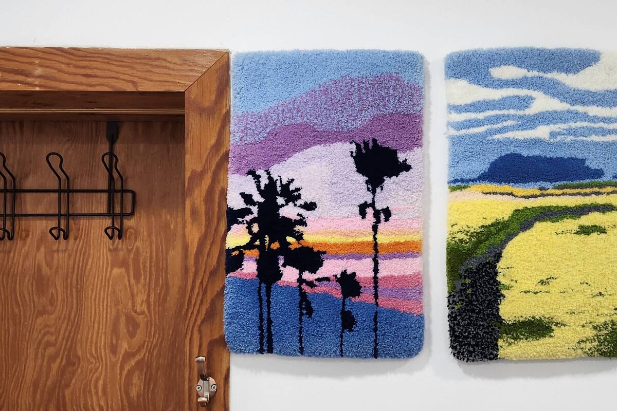 Two textured wall art pieces depicting landscapes.