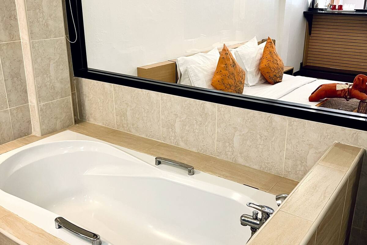 grand deluxe double room with pool view | bathroom | free toiletries, hair dryer, towels