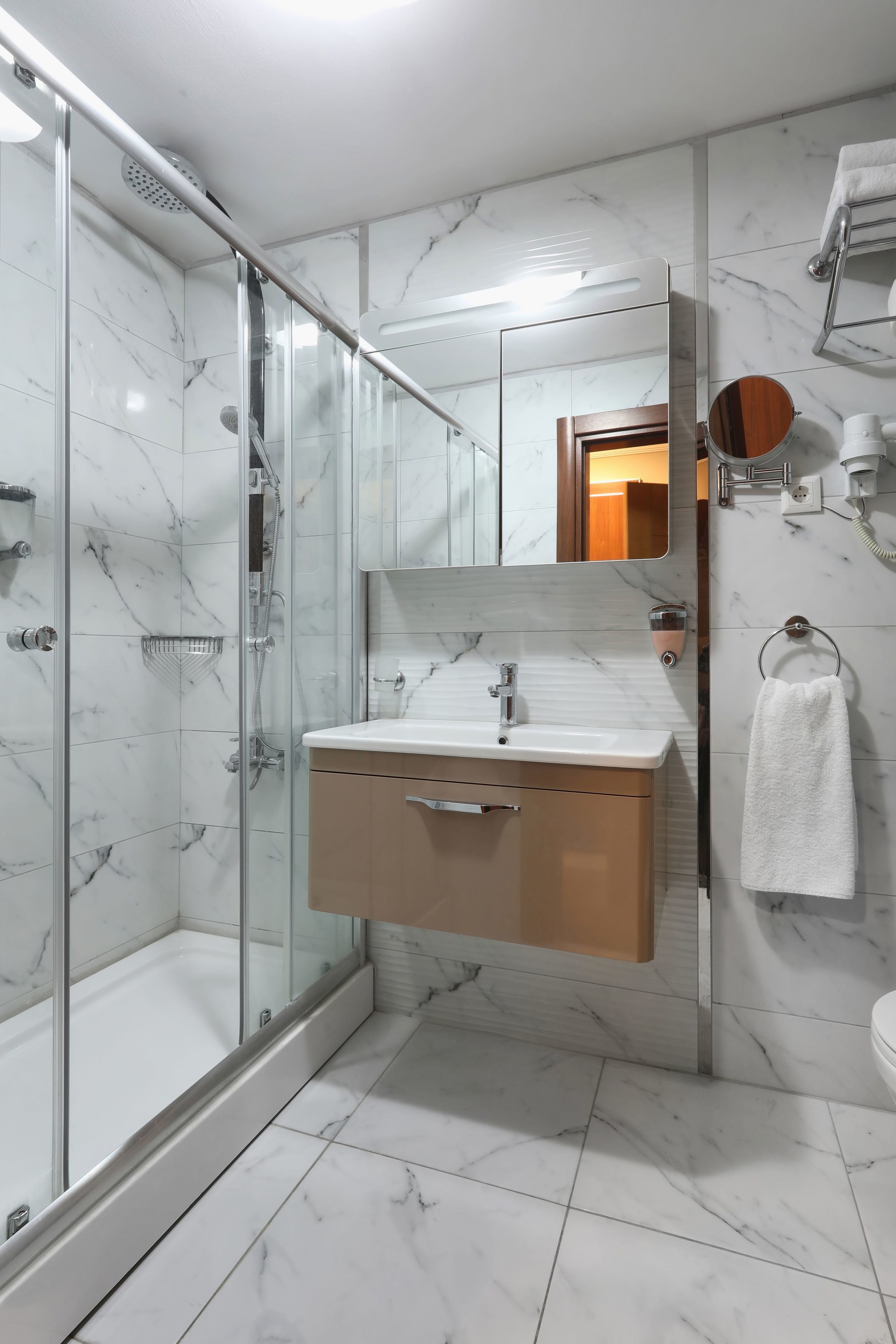 basic suite | bathroom | shower, free toiletries, hair dryer, slippers