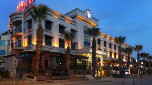 A hotel with a prominent 'New York' sign, a balcony, and a 'B' logo. - New Balturk Hotel Izmit (Izmit)