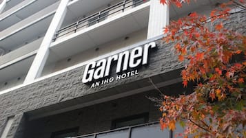 A hotel sign with the name 'Garnier' and 'An IHG Hotel' indicating it is part of the InterContinental Hotels group.