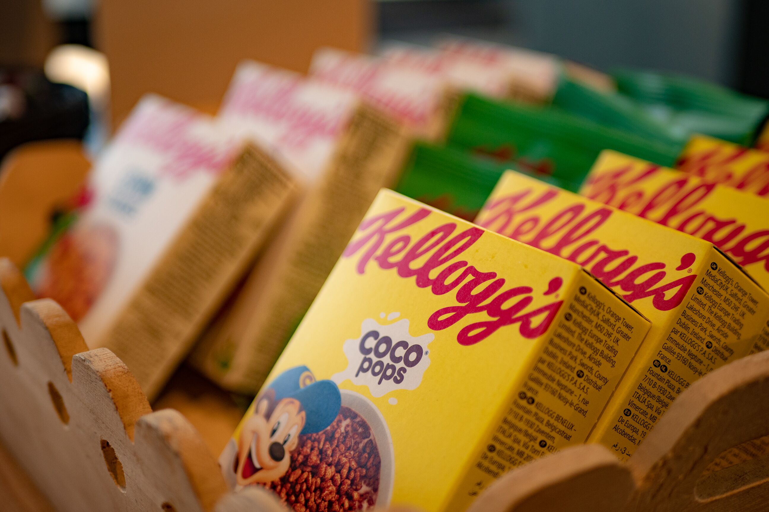 A display of Kellogg's Coco Pops cereal boxes in a store.
