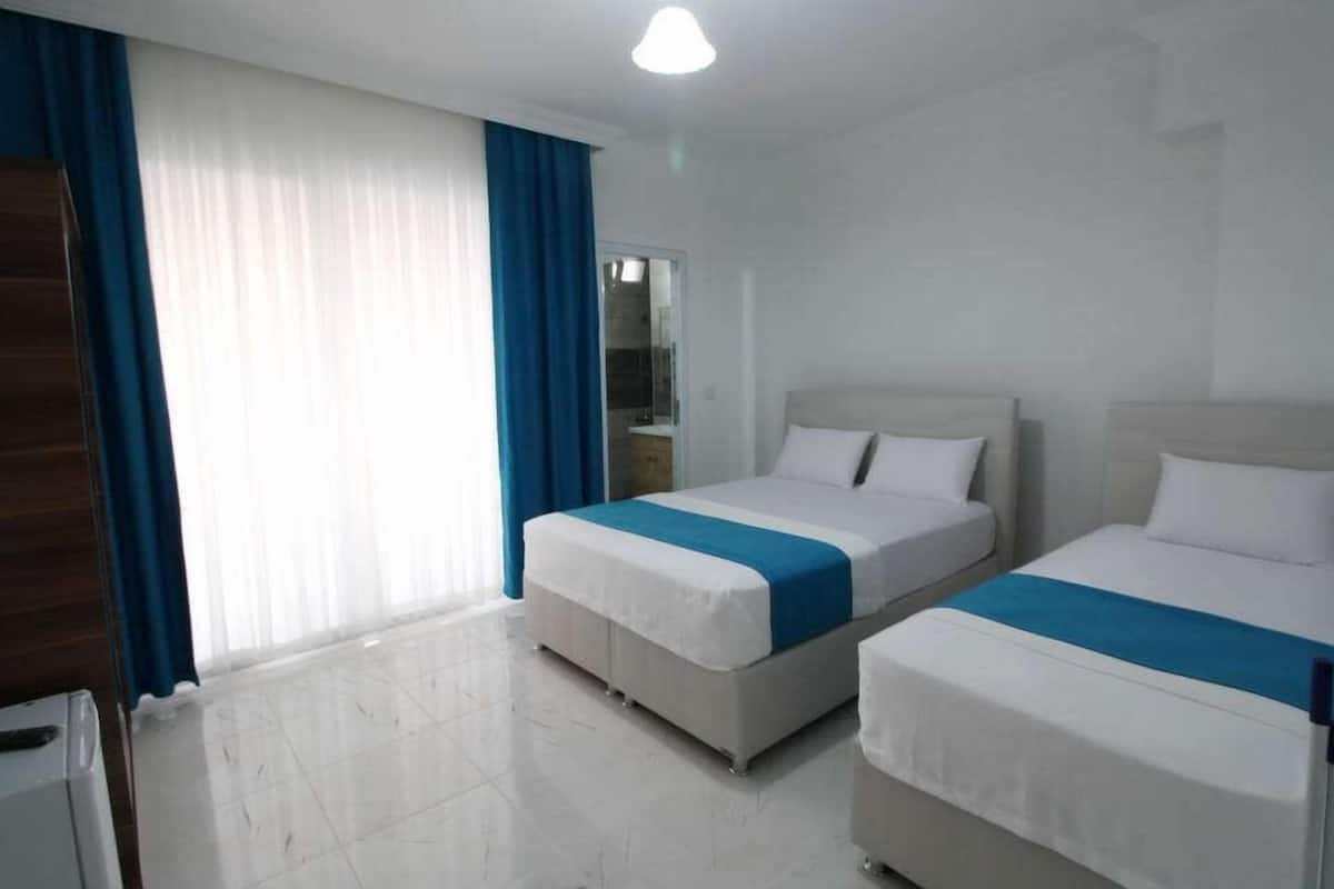 Deluxe Triple Room, Sea View | Desk, free WiFi