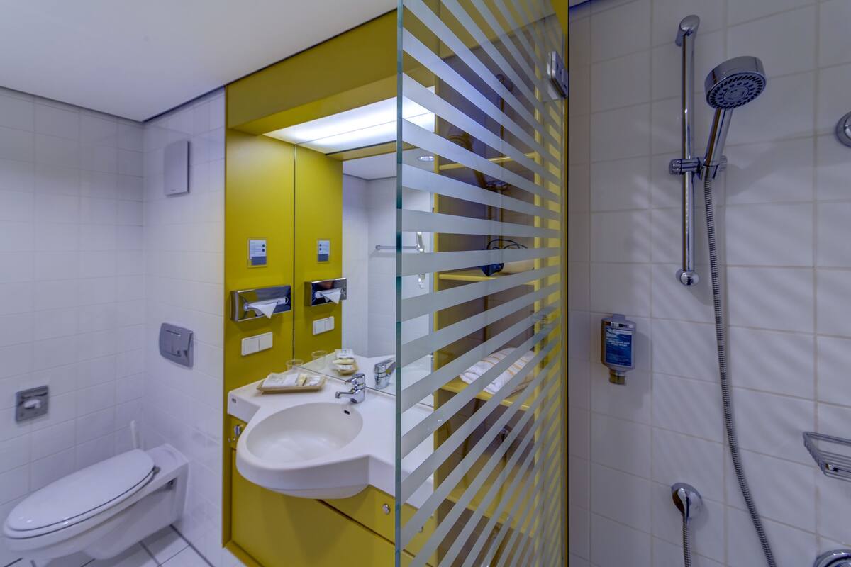 double room single use | bathroom | shower, hair dryer, towels, soap