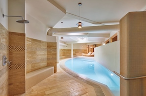 Indoor pool, open 7:00 AM to 10:00 PM, pool loungers