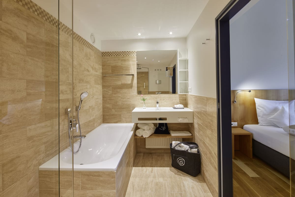 panoramic suite | bathroom | shower, free toiletries, hair dryer, bathrobes