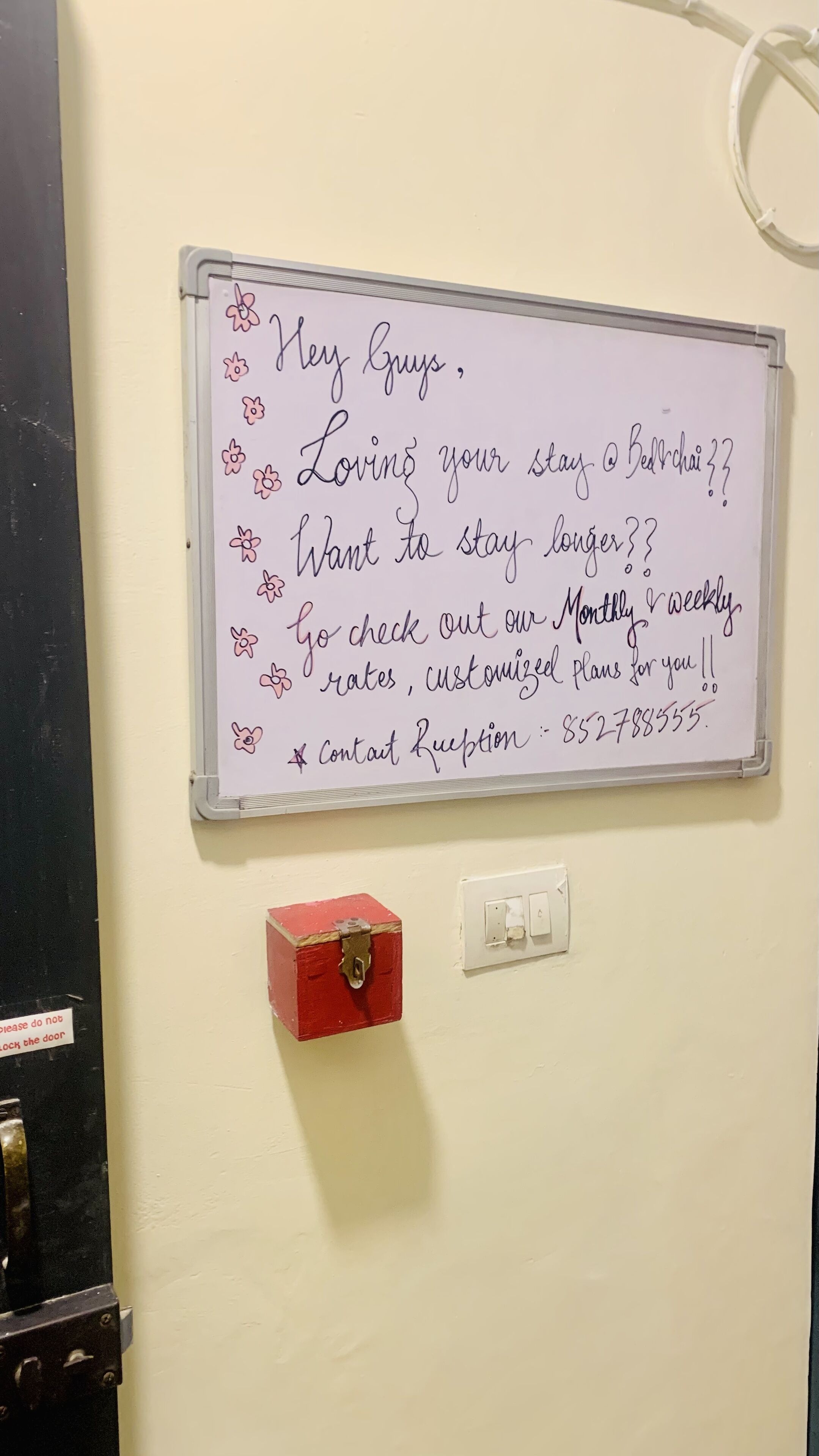 A whiteboard with handwritten text offering customized plans and contact information.