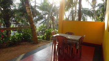 Relax in a serene outdoor space surrounded by lush greenery and vibrant surroundings.