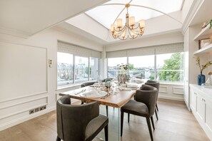 The Penthouse | Living area | 42-inch flat-screen TV with cable channels, TV