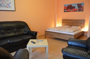 Apartment, 1 Bedroom | Desk, laptop workspace, blackout drapes, iron/ironing board