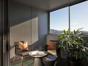 Luxe beddengoed, een minibar, een kluis op de kamer